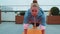 Athletic sport girl doing running plank, cross fitness, bodybuilding training routine on rooftop