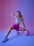 Athletic sportswoman doing exercise with ball