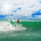 Athletic surfer with board