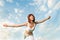 Athletic woman balancing in front of blue sky