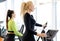 Athletic woman doing fitness cardio exercises in the gym. Two sporty women working out together
