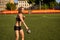 Athletic woman doing strength workout with kettlebell outdoor