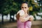 Athletic woman exercise and stretching in the park. Female athlete person, sport active in nature. Real people, green bokeh