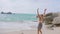 Athletic Woman Jogging Along the Beach