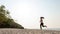 Athletic woman jogging and relax and freedom on sand beach