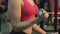 athletic woman lifting dumbbells in the gym, workout, fitness, slow-motion