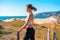 Athletic woman portrait outdoor. Caucasian female sportive woman standing on nature ocean beach