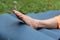 Athletic woman sitting in splits, Monkey yoga pose, asana Hanumanasana, stretching exercise. Part of the body. Foot in the