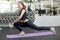 Athletic woman working out in fitness gym.