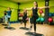 Athletic women on step aerobic training indoor