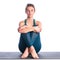 Athletic young blonde woman doing yoga practice isolated on white background.