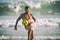 Athletic Young Brazilian Man Juggling Football Beach