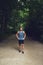 Athletic young man standing waiting in a park