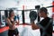 Athletic young people have sparring on the boxing ring