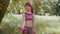 Athletic young sporty fit child kid girl doing dumbbells workout in park performing bicep exercising