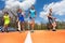 Athletics teenage boys running on the racetrack