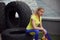 Athletics, after training with tyre. Smiling young female sportswoman sitting on a tire