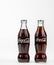 Atlanta GA USA May 1 2020 two classic glass Coca-Cola contour bottles close up