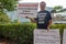 ATLANTA, UNITED STATES - Sep 25, 2020: An anti-vaccine protester stands outside of the CDC headquarters in Atlanta, Georgia with