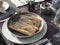 Atlantic jackknife razor clams close up served on cooking pan on sea food restaurant table at la Palma