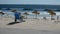 Atlantic ocean beach. Portugal. Costa da caparica. Man relax on the beach. Beach life. Relax. Waves blue. Sky. Parasol. Sand. Flag