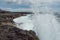 Atlantic ocean, coast of Inishmore, Aran Islands, County Galway, Ireland. Irish landscape. Powerful wave. Cloudy sky