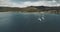 Atlantic ocean gulf, sailboats aerial zooming shot in Brodick Bay. Scottish landscape of port town