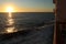 ATLANTIC OCEAN - OCTOBER 4, 2015: The sun sets over the Atlantic and RMS St Helena as it sails on one of its final voyages