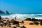 Atlantic ocean rocky coastline of Adraga beach with fisherman. Portugal