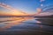 Atlantic ocean sunset with surging waves at Fonte da Telha beach, Portugal