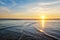 Atlantic ocean sunset with surging waves at Fonte da Telha beach, Portugal