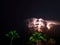 An Atlantic Ocean thunderstorm rages over the dark ocean horizon