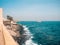 Atlantic ocean, view from Senegal coast, blue sea with tourist vessel ship, tropical landscape