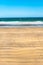 Atlantic ocean windy coastline with waves on a blue sky background.