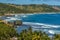 Atlantic roller waves erode the boulders of Bathsheba Beach on the east coast of Barbados
