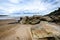 Atlantic sandy beach in Spain with city of Coruna background.