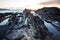 Atlantic sunset over Canary Island. Sea wave breaking against coast rock in sunset time