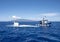 Atlantis IV submarine submerging, and submarine support vessel `Roxie` in the Pacific Ocean off the Island of Maui in Hawaii.