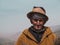 ATLAS MOUNTAINS, MOROCCO - March 28, 2018: Portrait of an old man in the Atlas mountains selling herbs