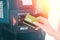 ATM and banking operations. A woman leans a Bank card in the reader at the ATM. Close up