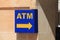 Atm sign on wall outside at sunny day in Malta