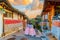 The atmosphere before the sunset at Bukchon hanok village, tourists dressed in hanbok to take pictures and watch the view because