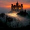 atmospheric ancient castle at sunset with low mist
