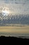 Atmospheric cloudscape over a silhouetted coastline, New Zealand