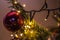 Atmospheric, colorful Christmas decoration with fairy lights and shiny Christmas balls