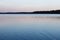 Atmospheric dusk over calm lake