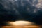 Atmospheric and mesmerizing sunset in cloudy weather. The shape of a circle and a tunnel. Landscape and weather forecast