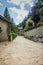 On the atmospheric paved street and Rustic house in the medieval village of Rupit in the mountainous part Catalonia. Spain