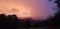 An atmospheric sunset over farmland
