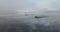 Atmospheric video of a river floating in the cold. Taken by a drone. Volga, Samara. Ships freezing in the ice.